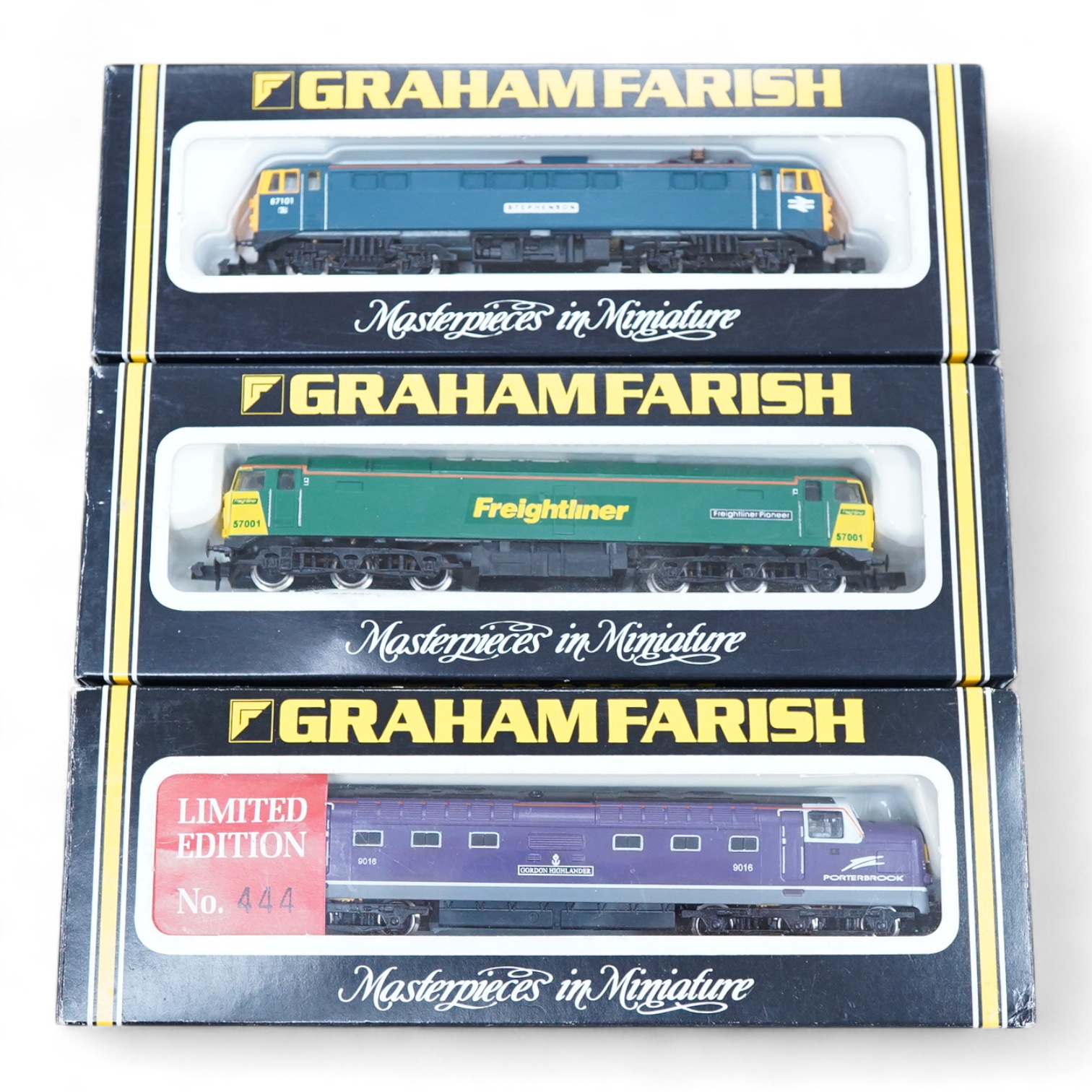 Three boxed Graham Farish N gauge railway electric and diesel locomotives; a Porterbrook class 55, Gordon Highlander (LE841A), a Freightliner class 57, Freightliner Pioneer 57001 (804A), and a BR class 87, Stephenson 871